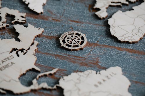 Compass Rose on a Wooden World Map