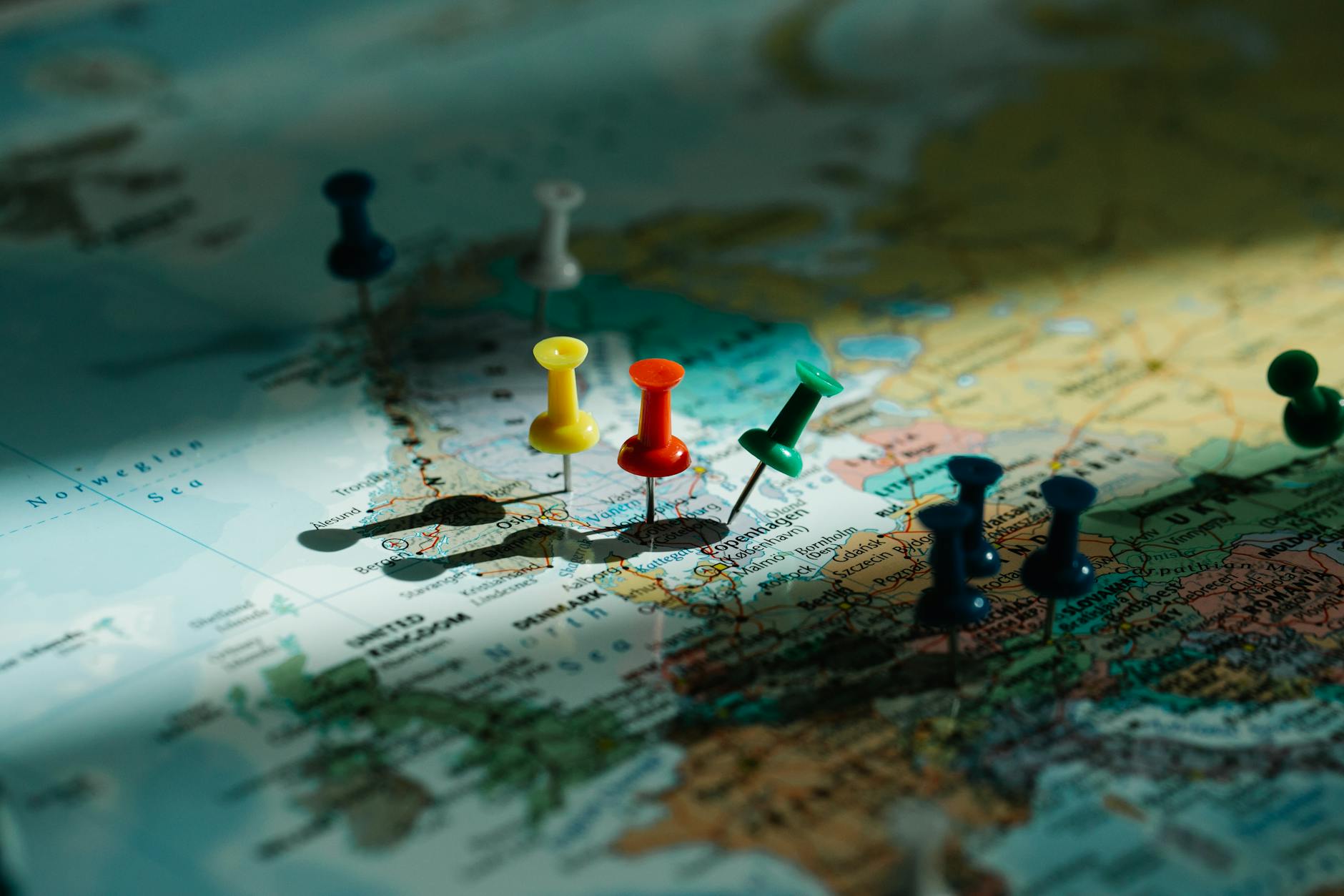 https://www.pexels.com/photo/close-up-og-pins-in-a-world-map-8828584/