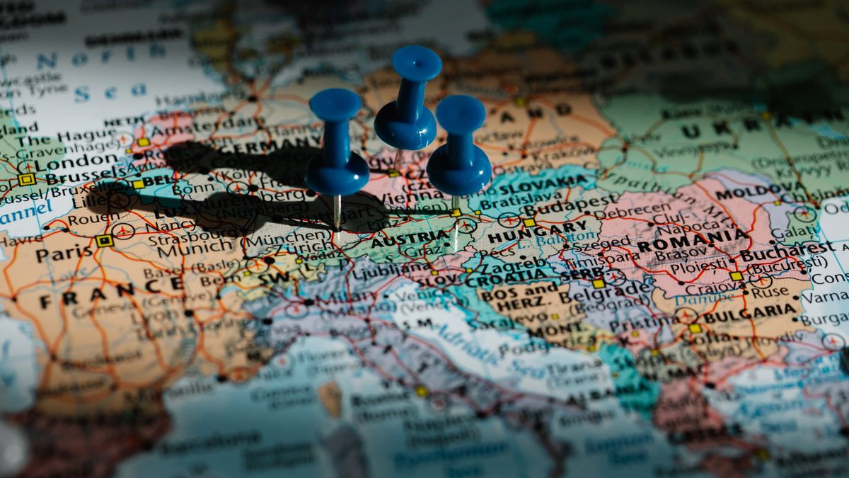 Close-up of a map of Europe marked with blue pushpins