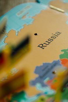 Detailed close-up of Russia labeled on a vibrant world map.