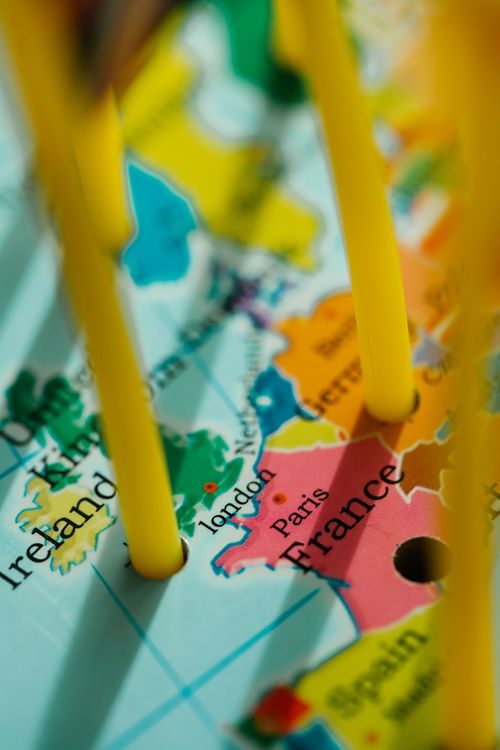 Free Close-up view of a Europe map with cities marked by pegs, highlighting travel destinations. Stock Photo