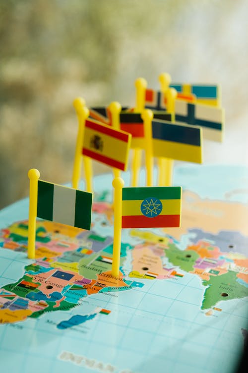 Free Toy Flags Pinned on World Map Stock Photo