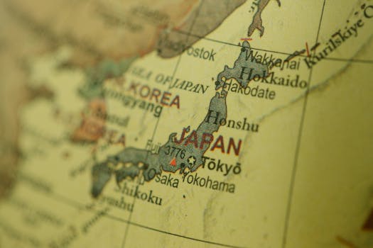 Close-up of a vintage map highlighting Japan and Korea with a selective focus.
