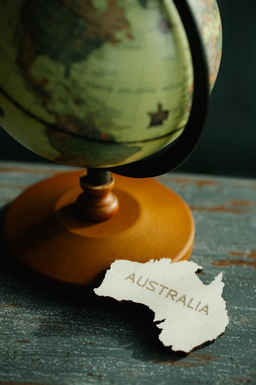 A Piece in the Shape of Australia by a Globe