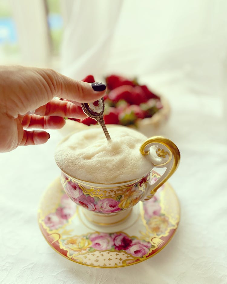 Hand Stirring The Foamy Drink 