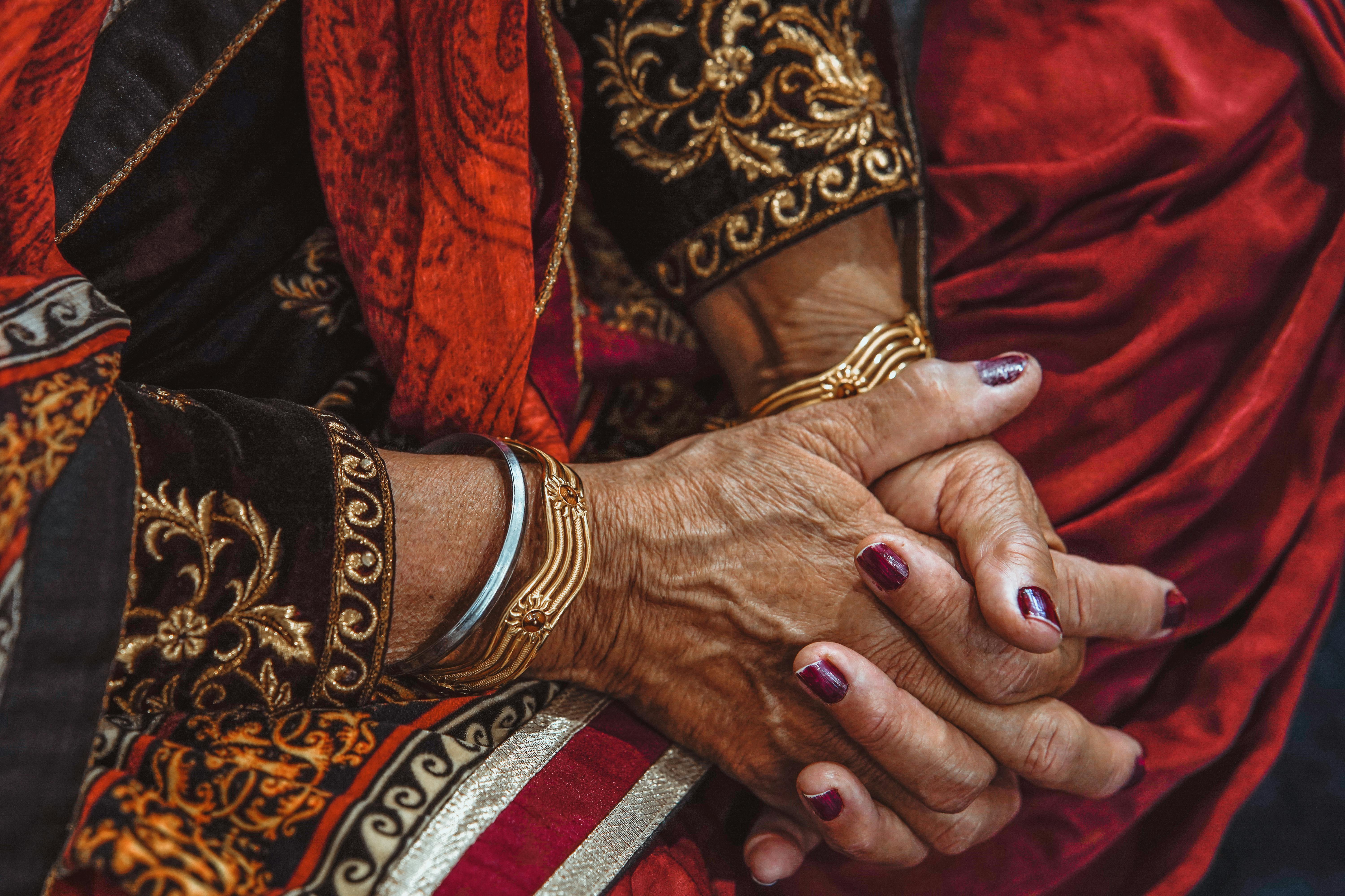 person wearing three bracelets