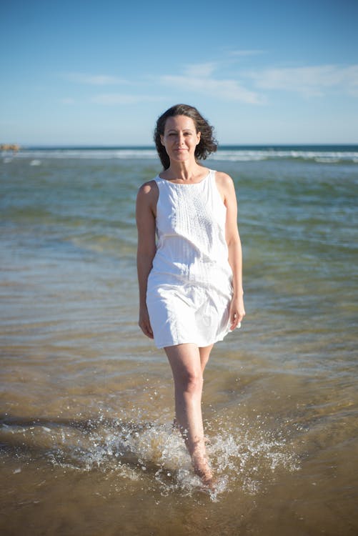 White dress top by the shore