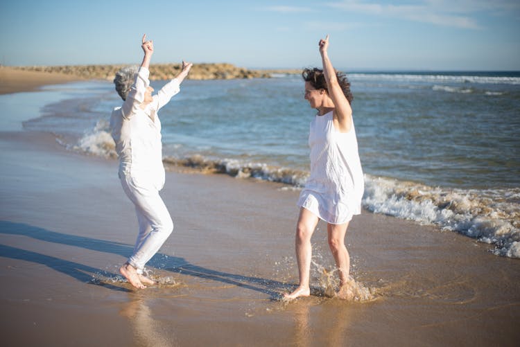 Women Dancing At The Beach