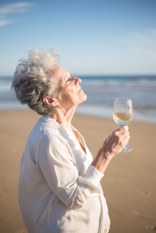 Elderly Woman Holding Wine Glass 