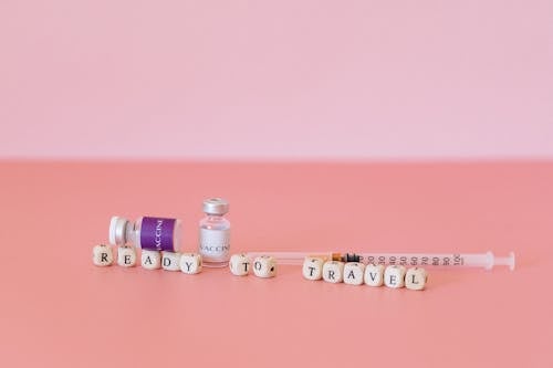 Free Vaccien Vials on Pink Surface Stock Photo