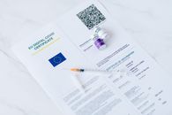 White and Purple Plastic Bottle on White Printer Paper