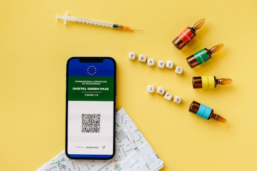 A digital green pass beside vaccine ampoules and a travel map on a yellow background.