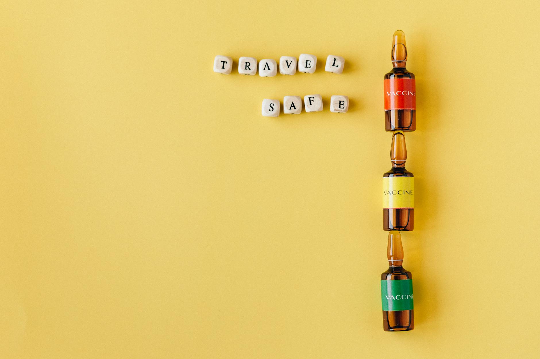 https://www.pexels.com/photo/vaccine-bottles-and-travel-safe-written-in-scrabble-letters-8830700/