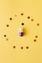 Gold Confetti around a Vial