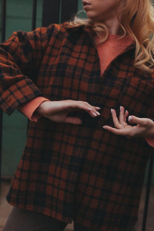 Woman in Red and Black Plaid Shirt with Manicured Nails