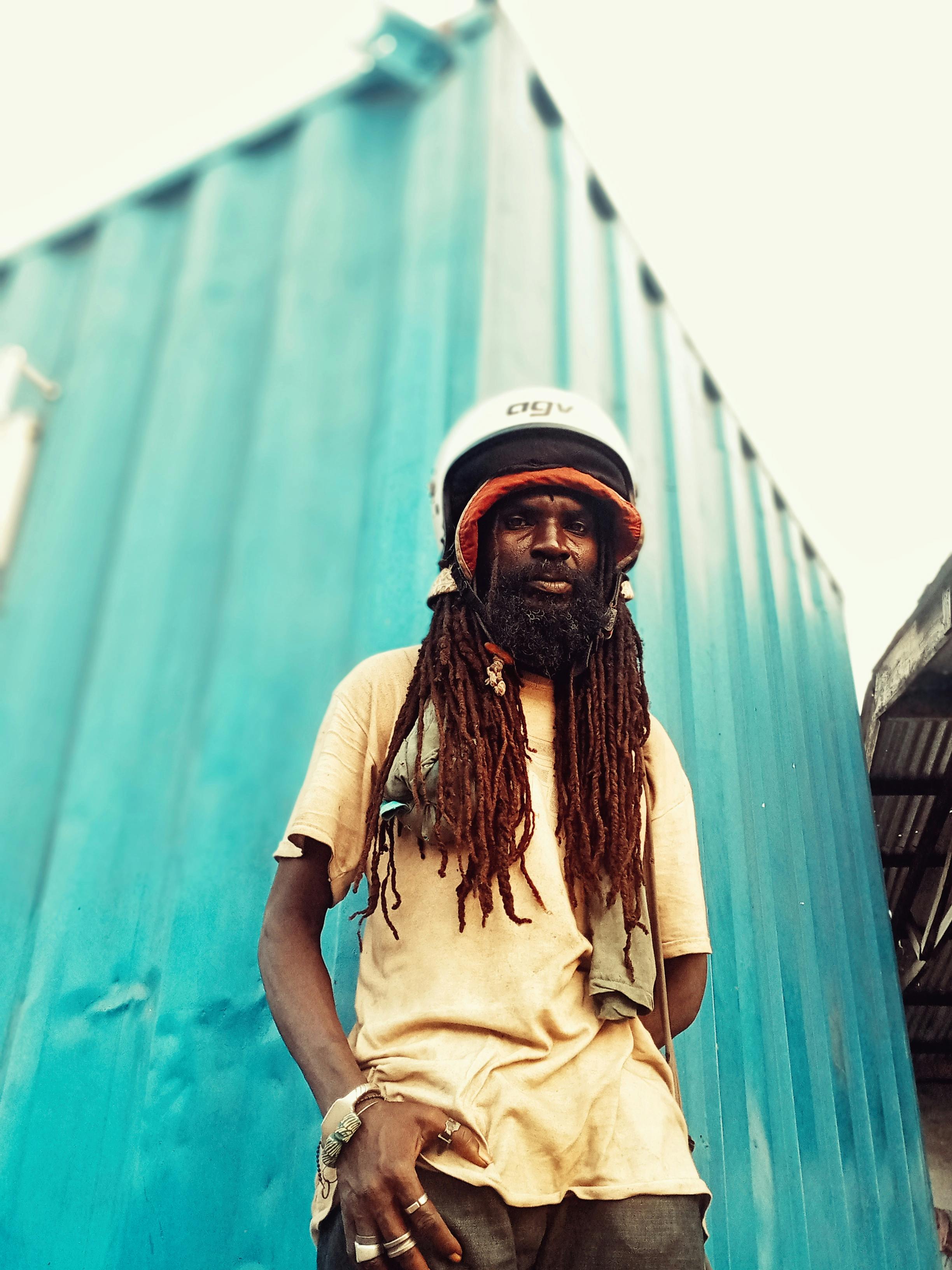 Man with Dreadlocks Wearing a Helmet · Free Stock Photo