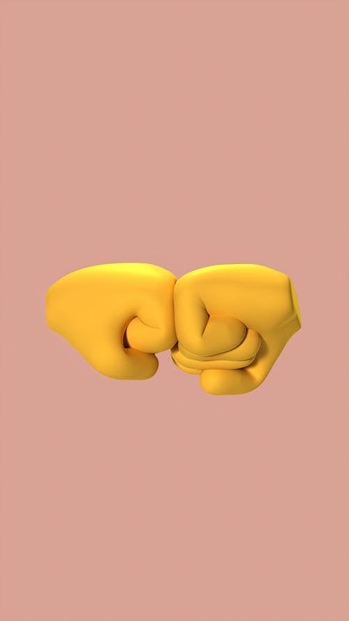 Yellow Hands Doing Fist Bump 