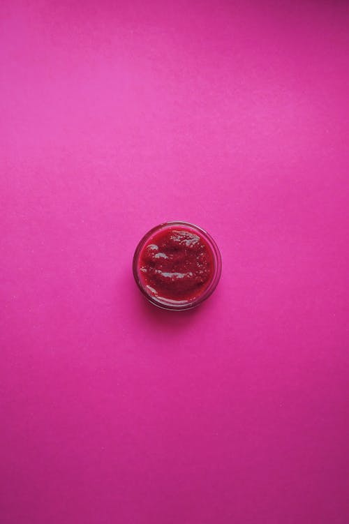 Silver Round Coin on Pink Textile