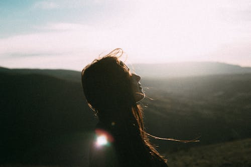 Free Side View of a Woman during Sunset Stock Photo
