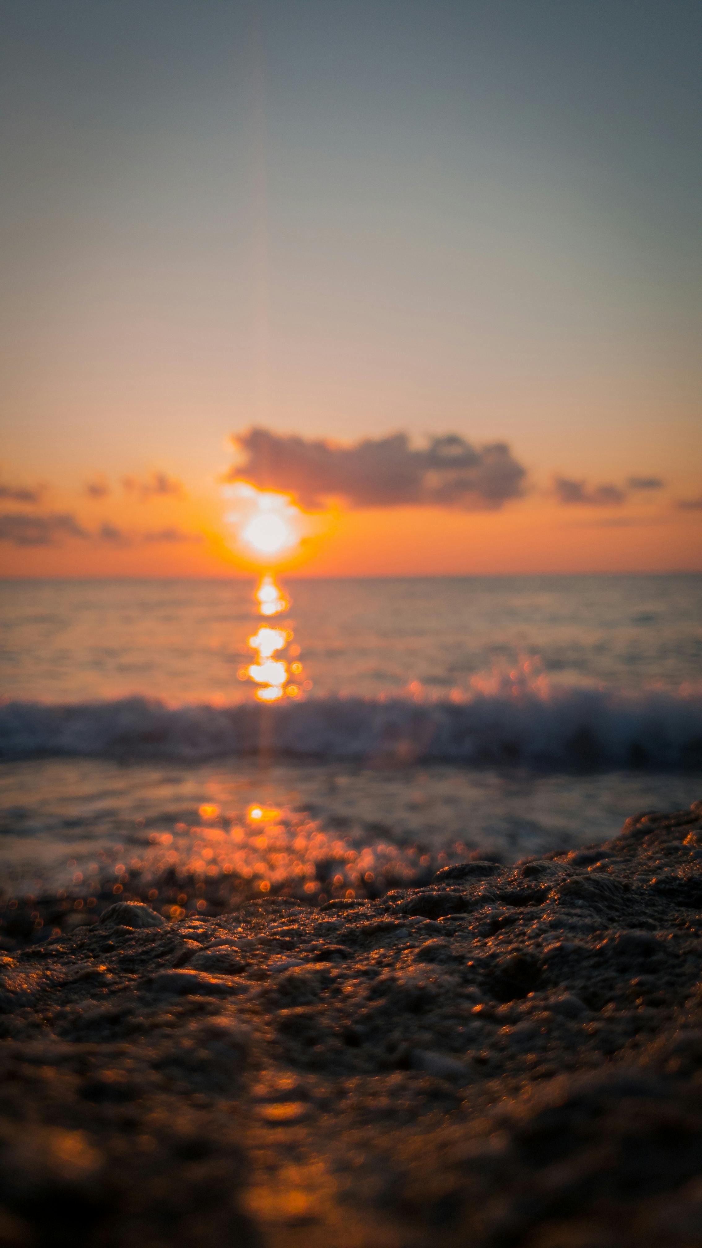 A Hand on the Water During Sunset · Free Stock Photo