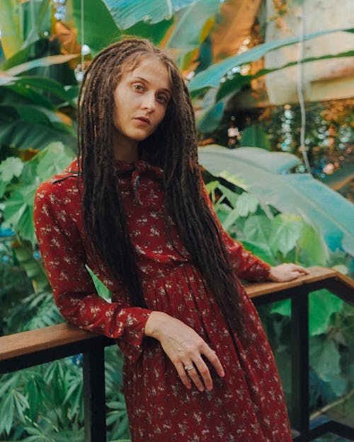 Woman with Dreadlocks in a Floral Dress 