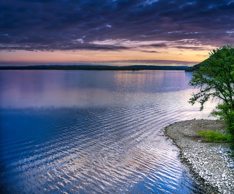 The Mississippi River Under A Cloudy Sky