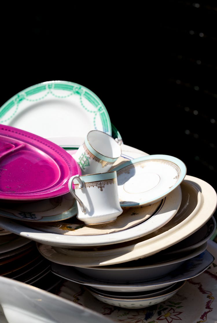 Teacups On Top Of Stacked Plates