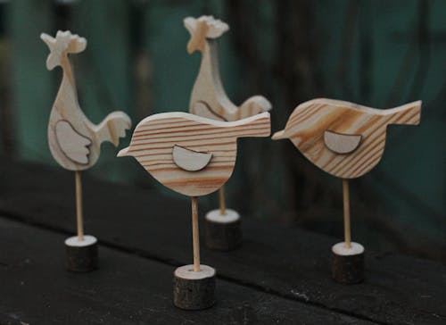 Close-Up Shot of Wooden Bird Figurines