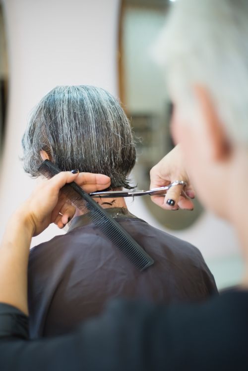Stylist cutting hair with precision
