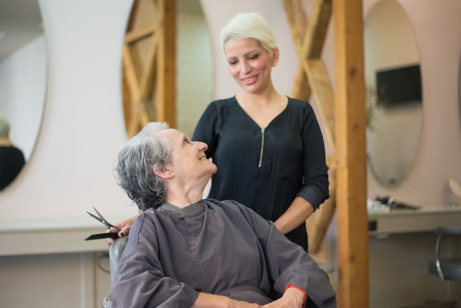 Happy senior enjoying a fresh hairstyle Happy senior enjoying a fresh hairstyle