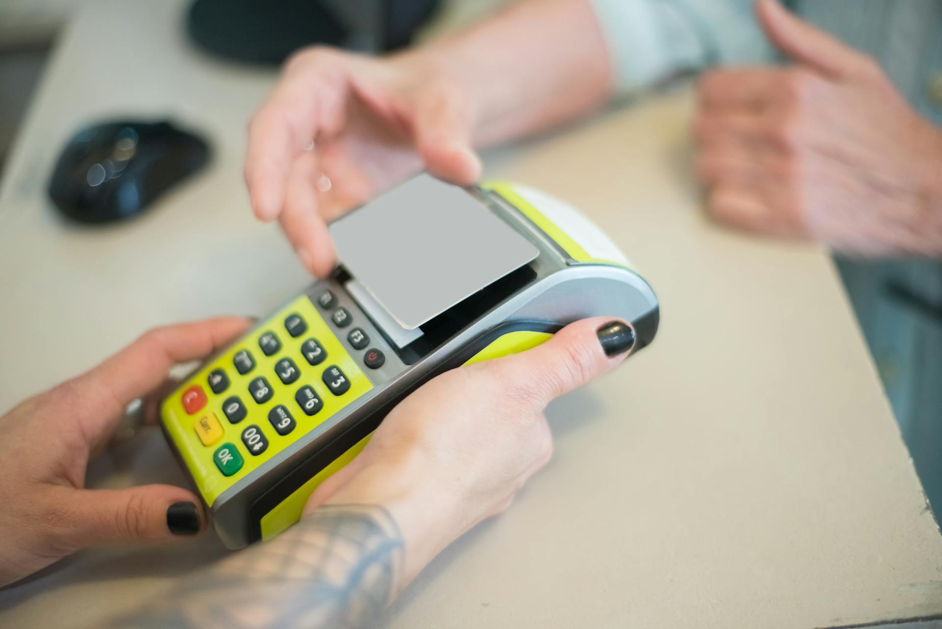 A Woman Scanning Her Card