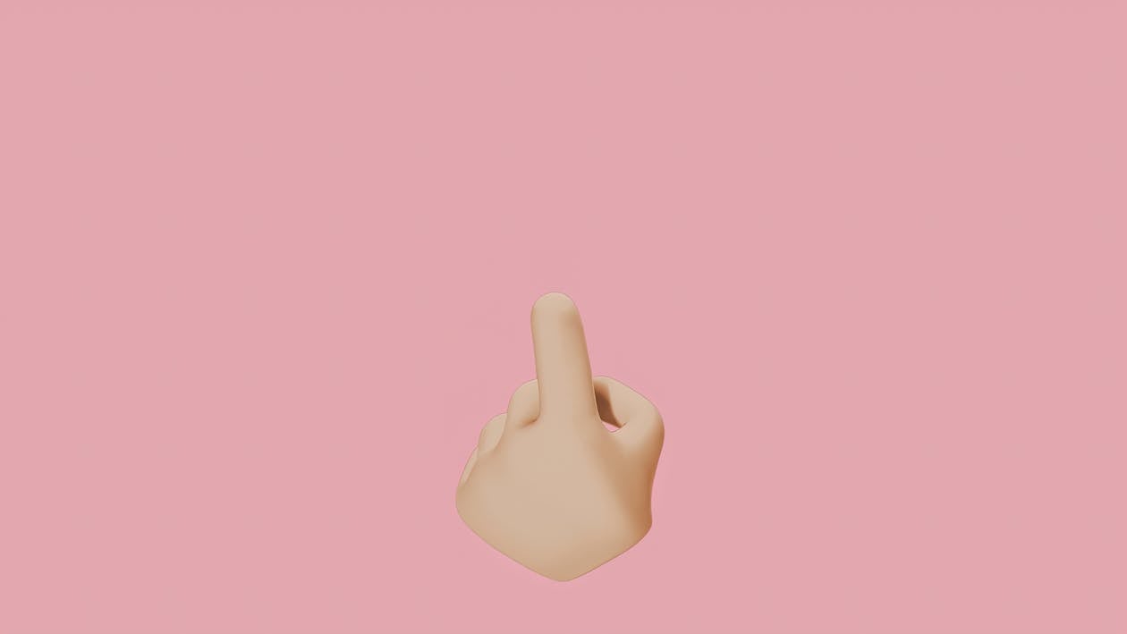 A Hand Pointing Finger on a Pink Background · Free Stock Photo