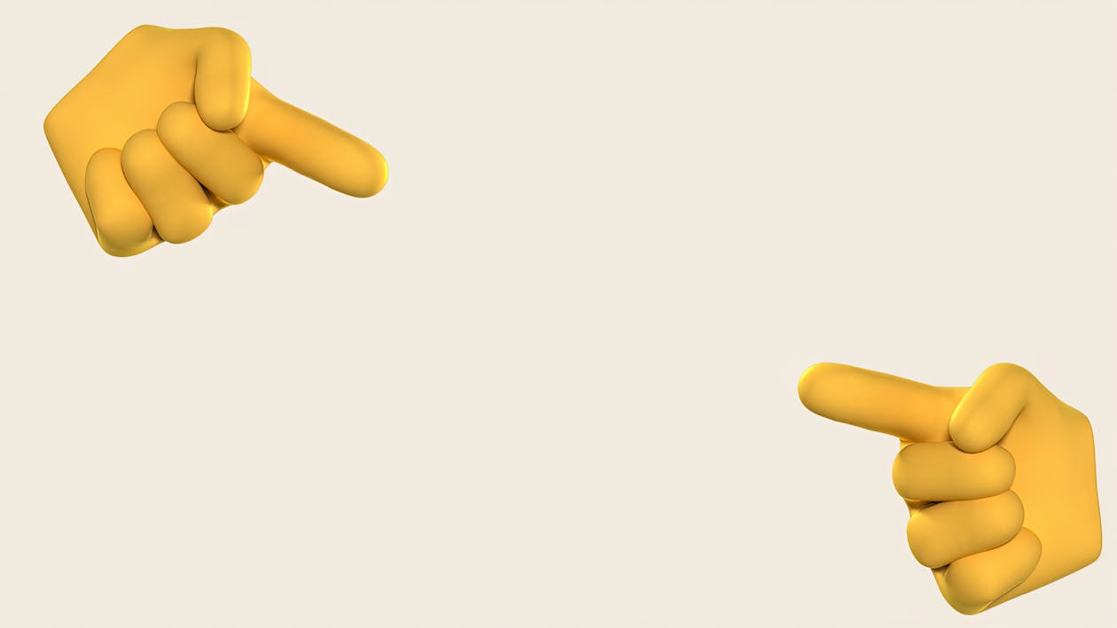 A Yellow Emoji Hand on Beige Background