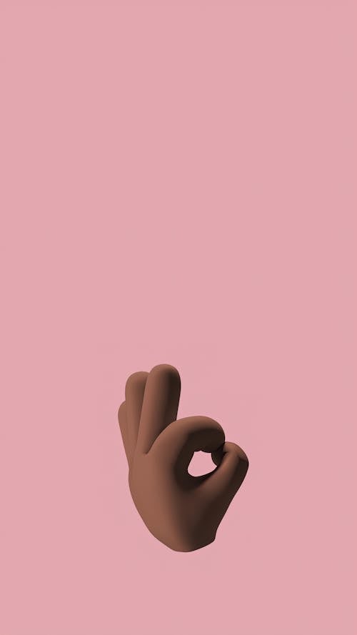 An Emoji Hand on Pink Background