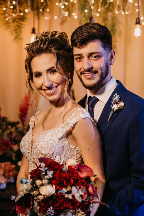 Free Beautiful portrait of a smiling bride and groom at an indoor wedding, showcasing romance and elegance. Stock Photo