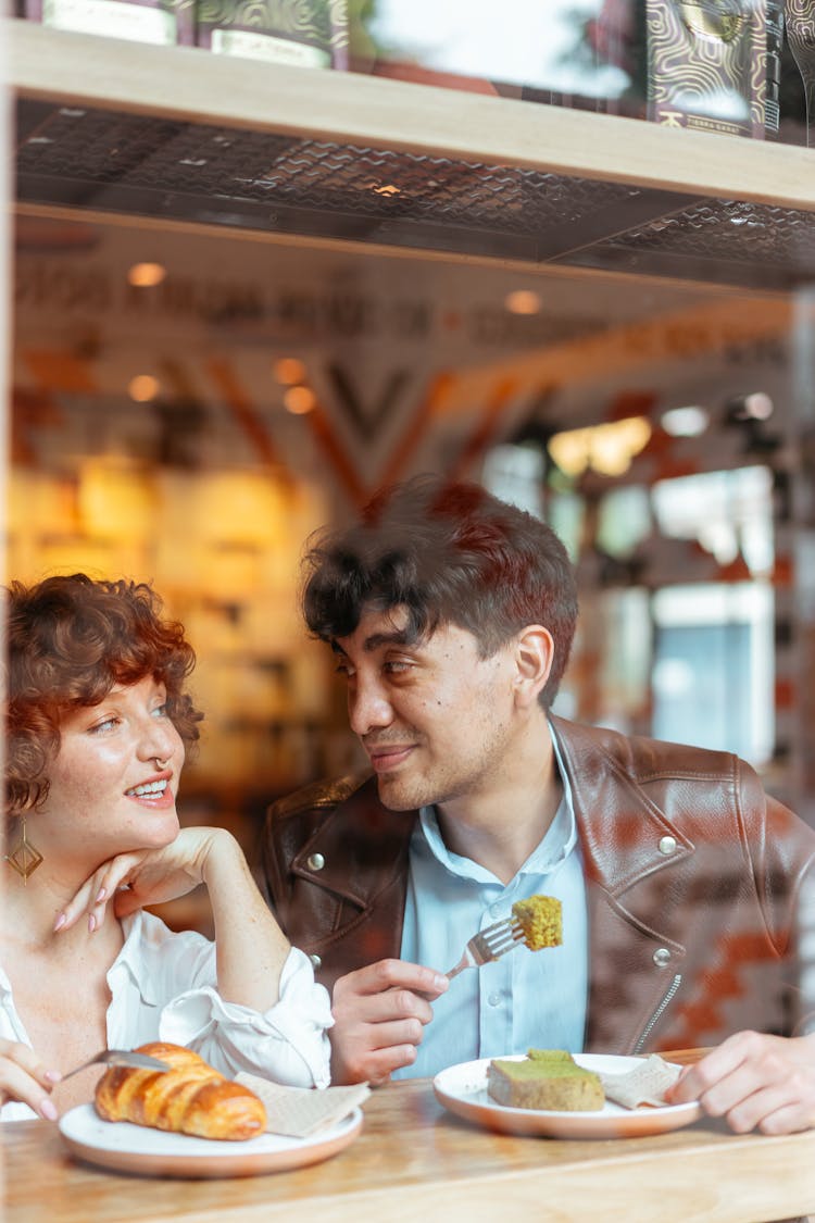 A Happy Couple Eating Together