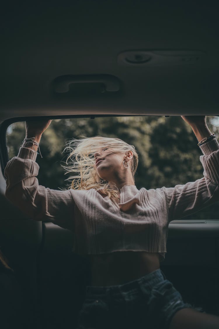 Girl Leaning Out Of The Car Window 