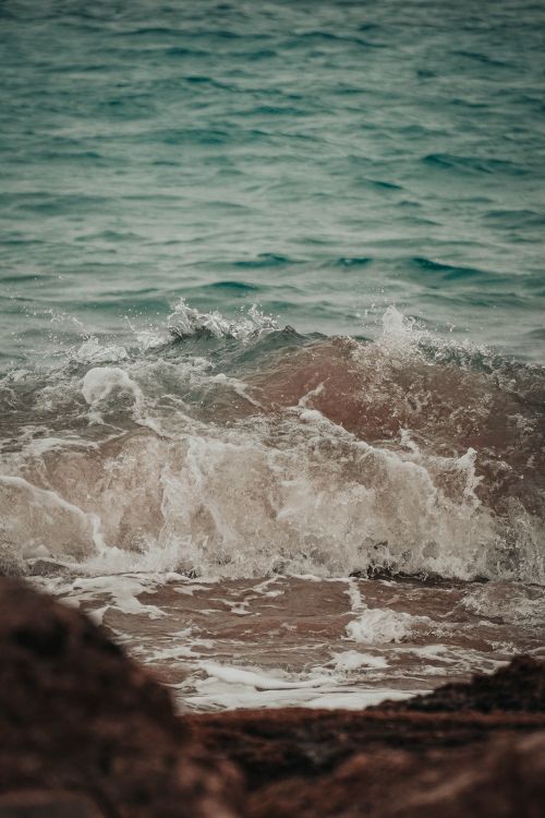 Free Dynamic shot of ocean waves hitting the shore at Lanzarote's coastline, capturing the energy of nature. Stock Photo