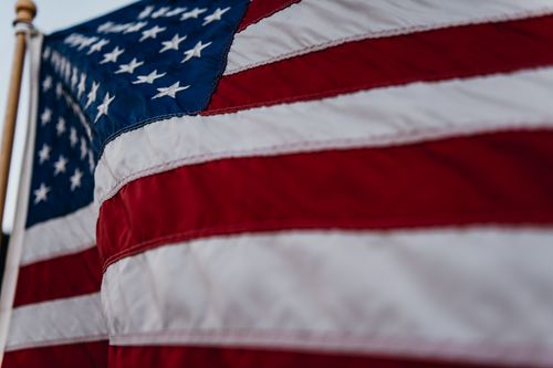 Free Detailed close-up of the American flag waving, symbolizing patriotism and pride. Stock Photo