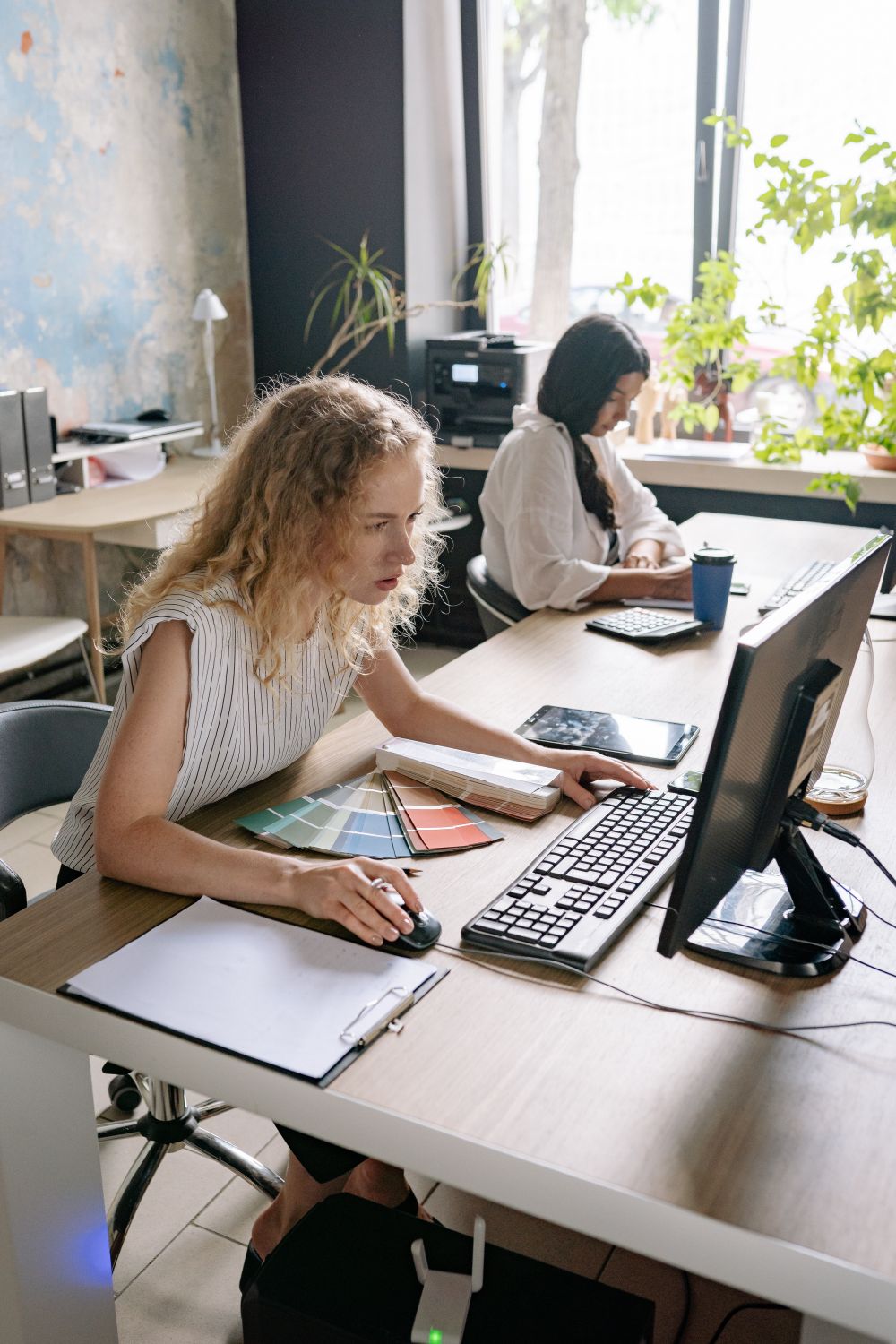 A Woman using a Computer · Free Stock Photo