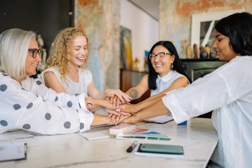Free Women Putting their Hands Together Stock Photo