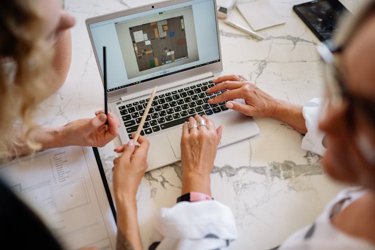 People Working On A Laptop 