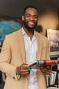 Smiling Man Holding a Pen and a Clipboard