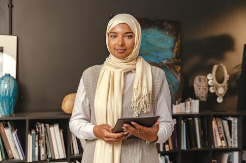 Free Woman in Hijab Holding a Tablet Stock Photo