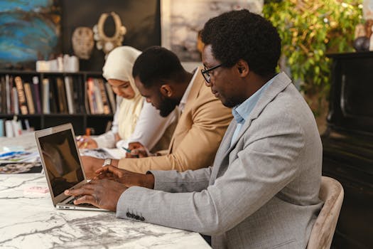 Group of diverse professionals working together in an office environment.