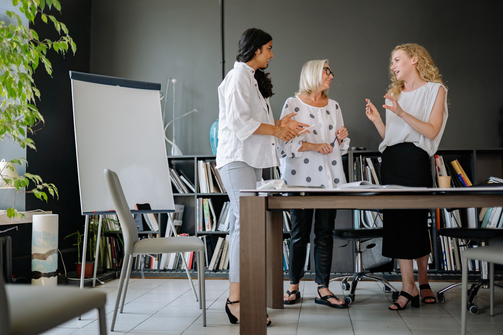 Women in the Meeting Room Having a Discussion