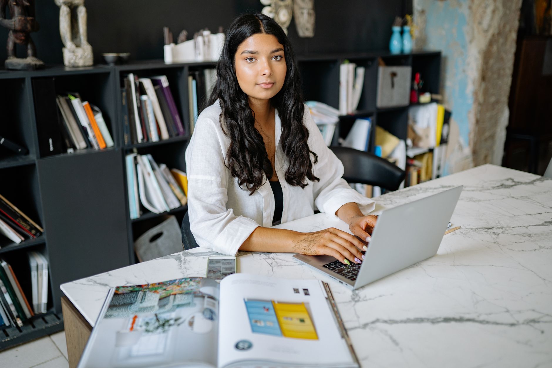 Indian small‑business owner generating brand assets with AI Indian small‑business owner generating brand assets with AI
