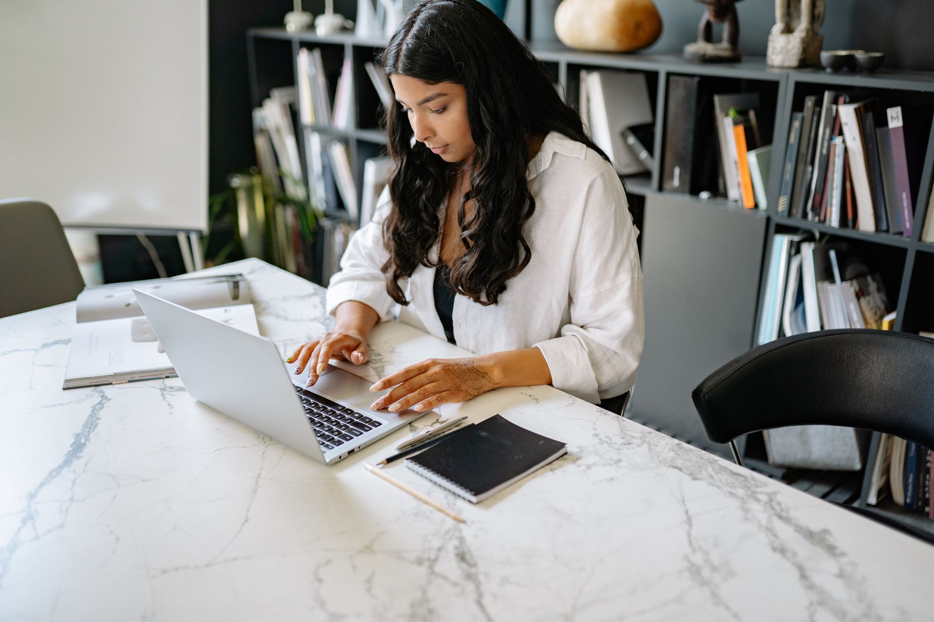 Woman working at an office desk — Ontario salary by sector