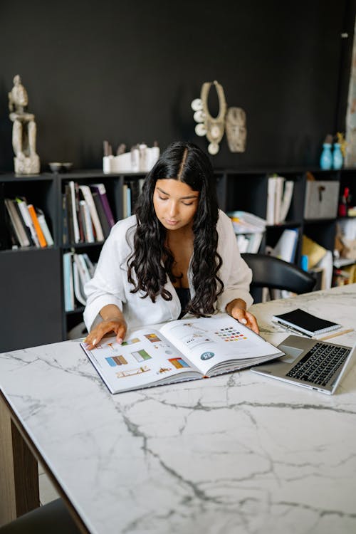 A Woman Inside an Office Working