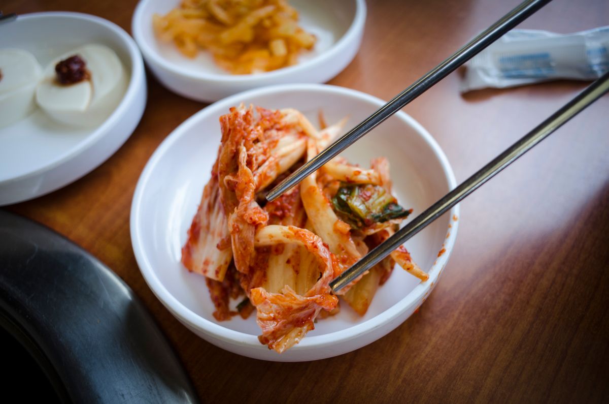 A Korean meal with kimchi and vegetable side dishes.